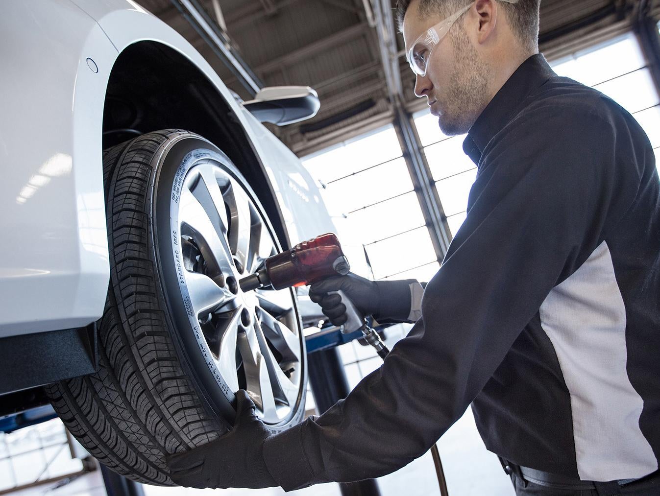A GM Certified Service Expert performs winter vehicle maintenance on a Chevy in City of Industry, CA