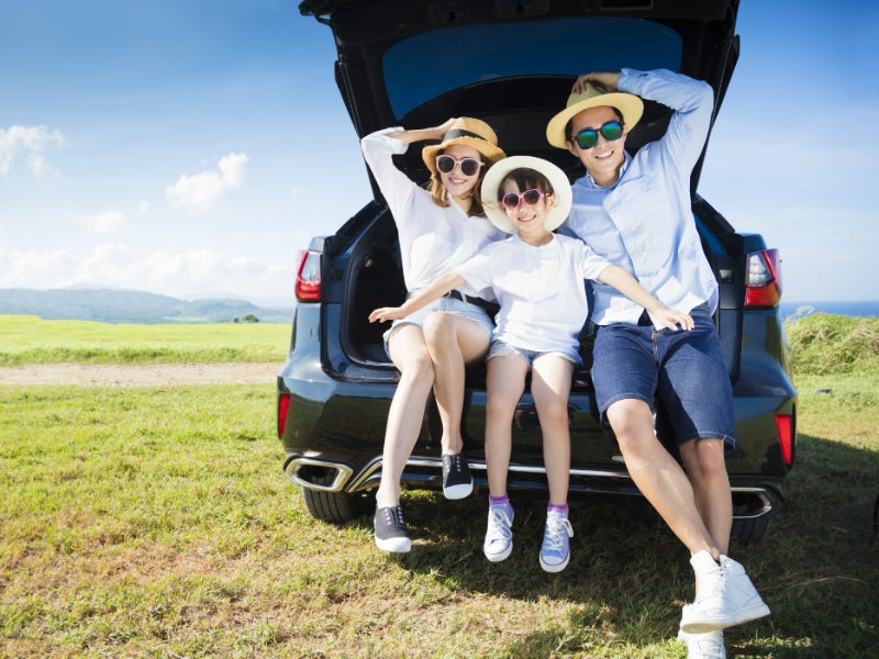 Image of a couple sigining document with finance team